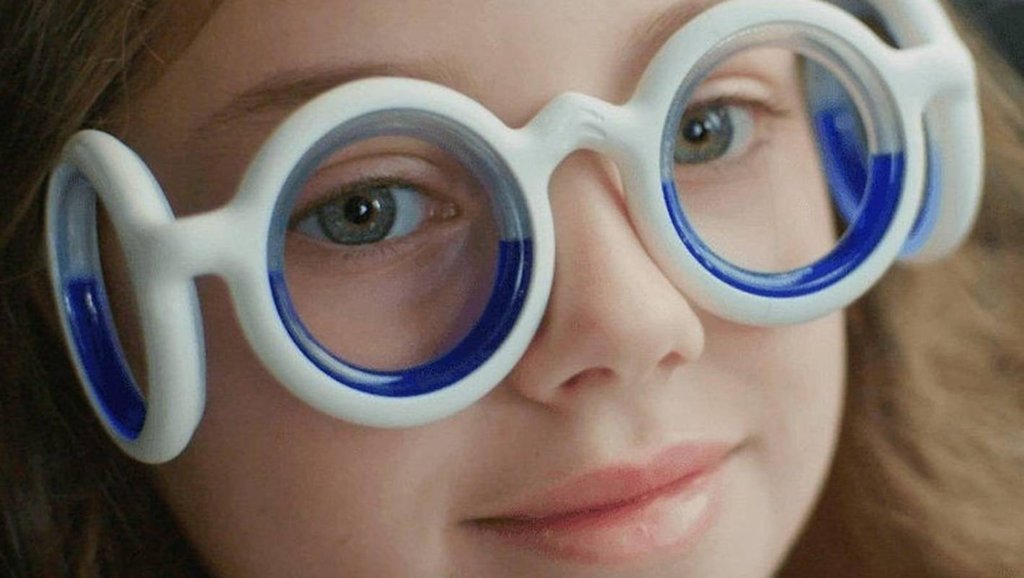 young girl wearing motion sickness glasses