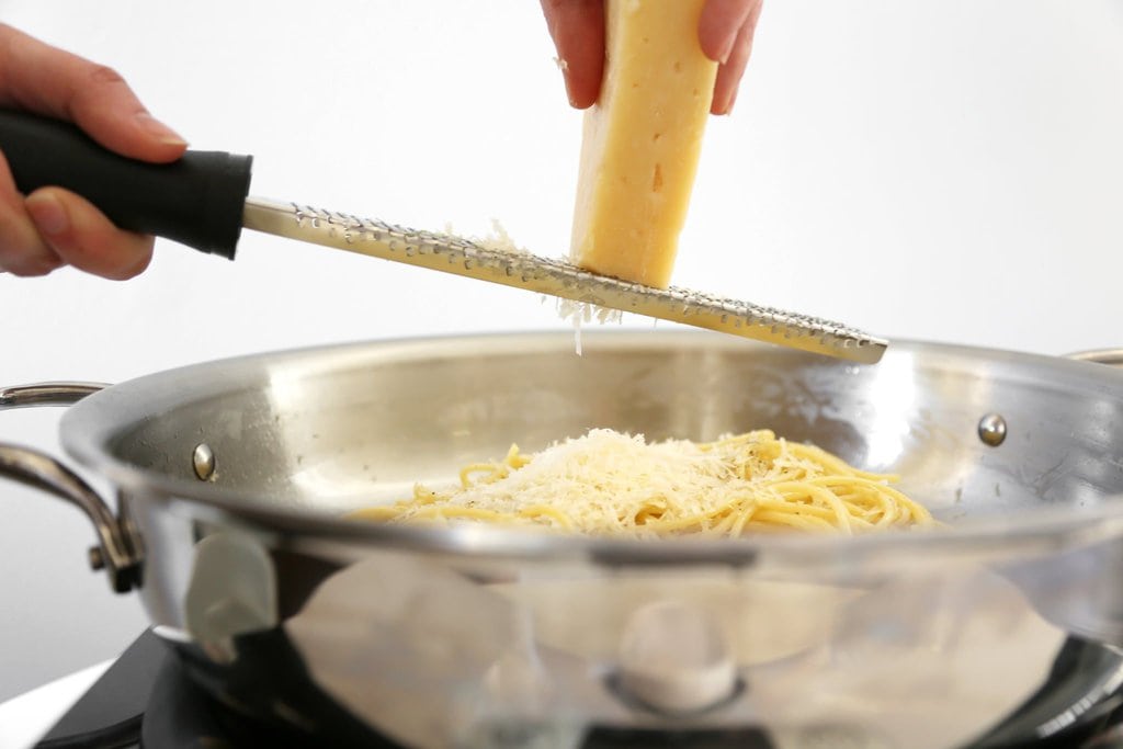 Adding Parmesan to Pasta